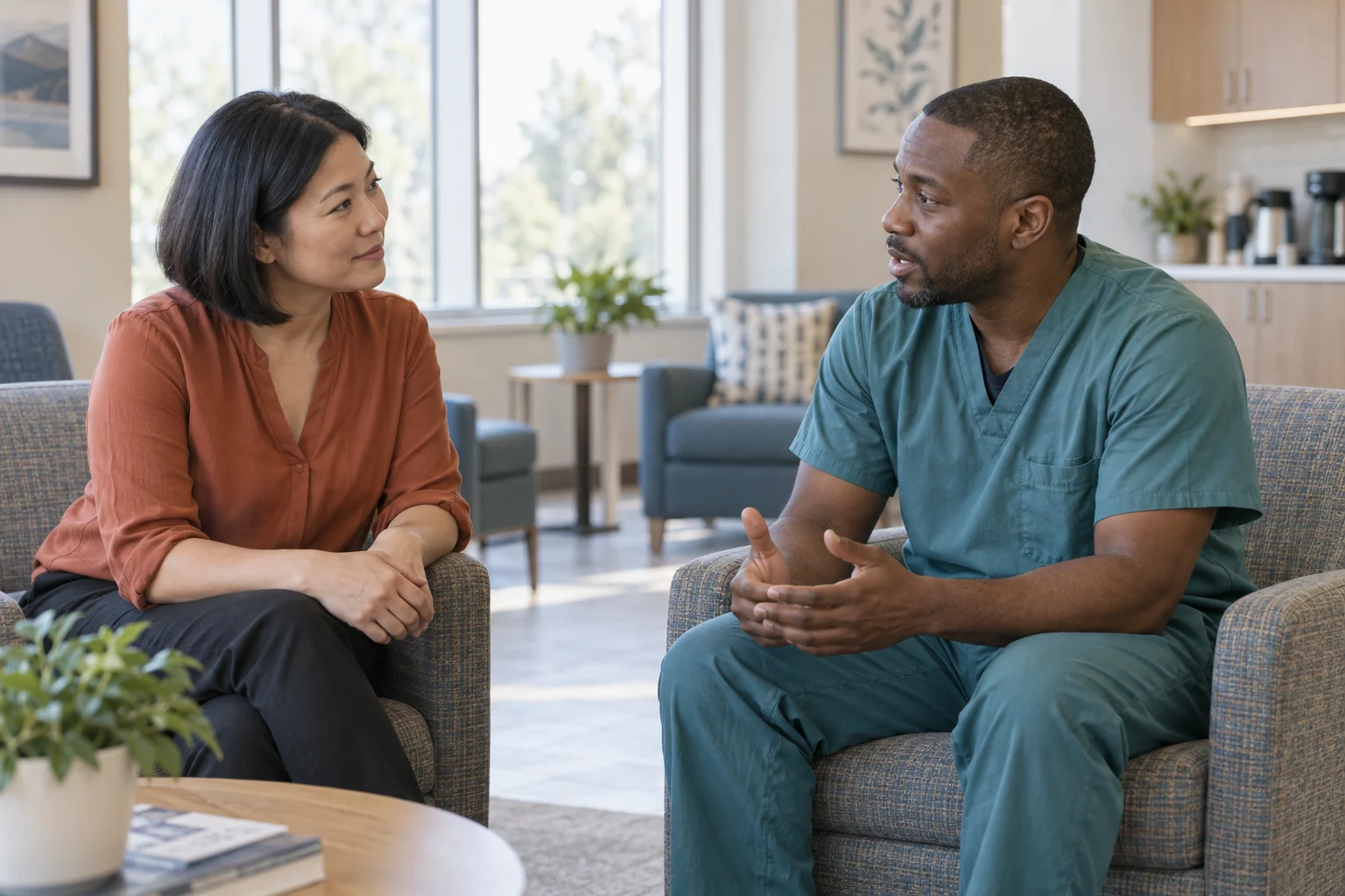 Illustrative recruiter and nurse talking in a hospital staff lounge